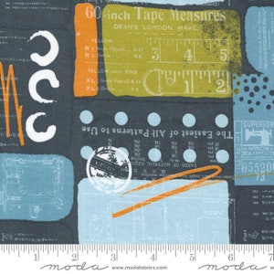 May include: Fabric with a repeating pattern of sewing-themed elements. The design includes tape measures, text, and illustrations in shades of blue, yellow, orange, and white on a dark gray background. The fabric has a ruler along the bottom edge.