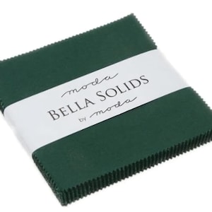 May include: A stack of 5-inch green fabric squares with the text "moda Bella Solids by moda" on a white label.