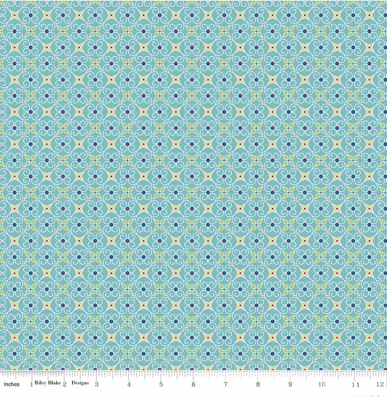 May include: A teal blue fabric with a repeating pattern of white, yellow, and green stylized floral designs.