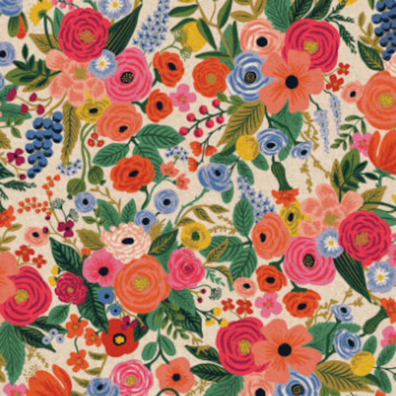 May include: A floral print fabric featuring a variety of colorful flowers, including pink, red, orange, yellow, blue, and green. The flowers are arranged in a random pattern on a cream background.