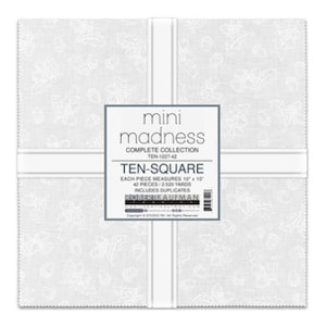 May include: A white fabric with a small, white floral pattern. The fabric is labelled "mini madness complete collection ten 1227-42 ten-square each piece measures 10" x 10" 42 pieces / 2520 yards includes duplicates  koenikaufman"