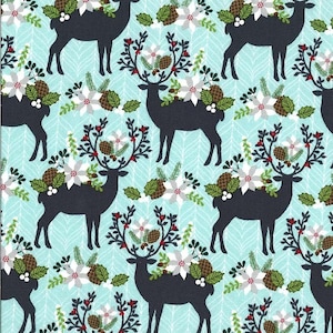 May include: A repeating pattern of black deer silhouettes with floral antlers, including white flowers, pinecones, and red berries. The background is a light blue with a subtle chevron design. This fabric design is suitable for holiday-themed crafts.