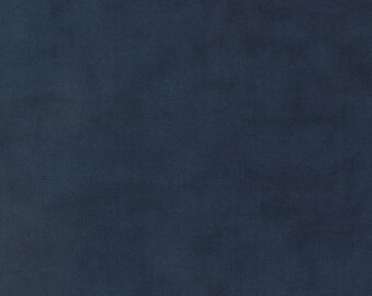May include: A close-up of a navy blue fabric with a soft, velvety texture. The colour is a deep, rich shade of blue, with subtle variations in tone across the surface. The fabric appears to be smooth and luxurious.