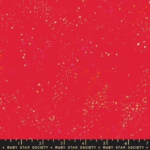 May include: Red fabric with a scattered gold glitter pattern. The fabric is a solid red color with a subtle sheen. The glitter is evenly distributed throughout the fabric, creating a subtle sparkle effect.