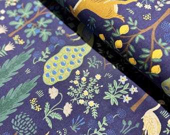 May include: A navy blue fabric with a repeating pattern of stylized peacocks, deer, and floral designs. The pattern includes yellow, green, and white accents.