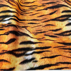 Katoenstof met tijgerprint: dierenrijk van Robert Kaufman