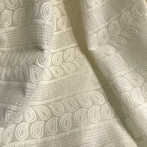 Hakoba Cotton Embroidered Fabric on Cream Background