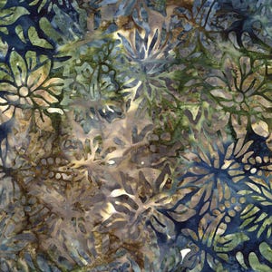May include: A fabric with a batik design featuring a floral pattern in shades of blue, green, and brown. The design has a layered effect with intricate details, creating a textured appearance. The overall aesthetic is organic and natural.