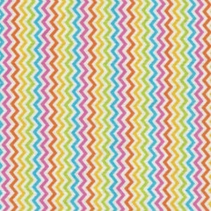May include: A close-up of a fabric with a repeating vertical zigzag pattern. The pattern features stripes of orange, yellow, green, blue, pink, and purple on a white background. The fabric is likely used for sewing or crafting projects.