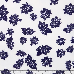 May include: White fabric with a navy blue floral pattern. The flowers are stylized and have a dotted outline.