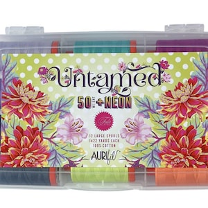 May include: A clear plastic storage case with 12 large spools of Aurifil thread. The spools are arranged in rows and are labeled "Untamed 50+ Neon". The label also includes the text "12 Large Spools, 1422 Yards Each, 100% Cotton".