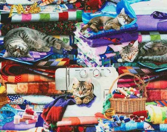 May include: A colorful fabric collage featuring multiple cats sleeping and playing on a stack of colorful patchwork quilts. The cats are various shades of brown, gray, and white. There are also sewing supplies, including spools of thread, a sewing machine, and scissors.