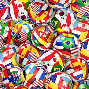 May include: A collection of soccer balls with various national flags, including the United States, Canada, Brazil, and South Korea. The balls are white with colorful flag designs, creating a vibrant and patriotic display. The image showcases a variety of international flags.