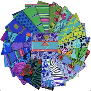 May include: A stack of square fabric swatches arranged in a circular fan pattern, featuring diverse floral, striped, and geometric prints in vibrant shades of blue, green, purple, and yellow, secured by a band labelled Kaffe Fassett Collective.