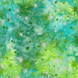 May include: A fabric pattern featuring a watercolour-style background in shades of lime green, emerald, and teal. The design is overlaid with scattered, multi-pointed star shapes and small circular dots in a metallic silver, glittery finish.