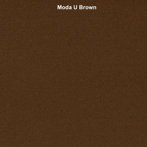 May include: A close-up of a brown fabric with a textured weave. The fabric has a subtle sheen and a slightly rough feel.