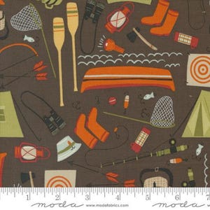 May include: A brown fabric with a repeating pattern of camping and fishing gear. The pattern includes a canoe, fishing rods, a tent, a lantern, binoculars, a compass, a target, arrows, and a fishing net.