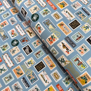 Rifle Paper Co. Bon Voyage Fabric: Blue Metallic Postage Stamps