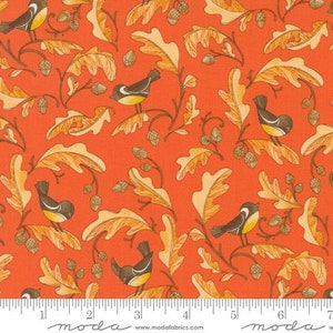 May include: A red fabric with a repeating pattern of yellow leaves and small birds. The birds are black and white with yellow beaks. The fabric has a subtle texture.