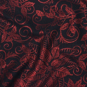 May include: Red and black fabric with a repeating pattern of stylized leaves and swirls. The fabric has a textured, almost metallic, look.