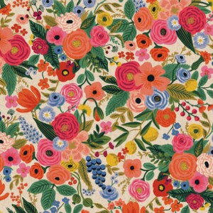 May include: A colorful floral pattern with a variety of flowers in shades of pink, red, orange, yellow, blue, and green. The flowers are arranged in a random pattern on a cream background.