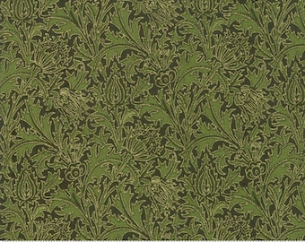 May include: Green fabric with a repeating floral pattern. The design features stylized flowers and leaves in shades of green and gold against a dark green background. The fabric has a textured appearance, and a ruler is visible along the bottom edge.