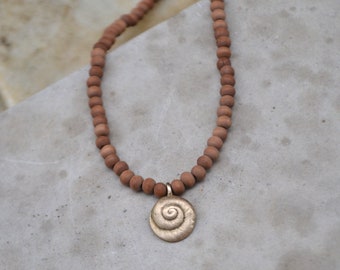 Spiral of the Sea necklace, handcrafted bronze pendant on wooden beaded necklace