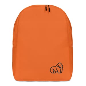 May include: Orange canvas backpack with a black outline of a gorilla on the front.