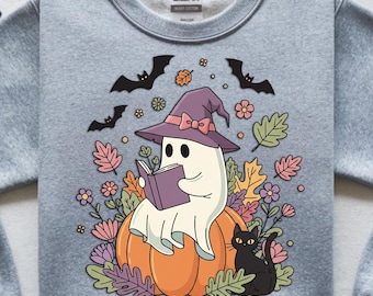 Ghost Reading on Pumpkin with Witch Hat & Black Cat | Spooky Halloween Illustration Booktrovert T-Shirt