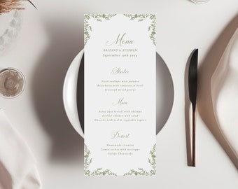 Puede incluir: Una tarjeta de menú de boda con un borde floral verde. El menú incluye opciones de entrantes, plato principal y postre. El texto dice "Menu", "Brittany & Stephen", "September 19th 2014", "Starters", "Fresh scallops with polenta", "Bruschetta with tomatoes & basil", "Seasoned mixed greens", "Main", "Seared basa served with shrimps", "Grilled chicken salad", "Gnocchi with veal & vegetable ragout", "Dessert", "Homemade tiramisu", "Lemon sorbet with meringues", "Italian Cheesecake", "DREAM PAPER COMPANY".