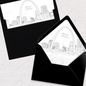 May include: A black and white illustration of the Gateway Arch in St. Louis, Missouri. The text "Meet us in St. Louis" is written in cursive above the arch.