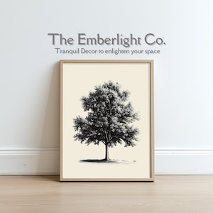 Puede incluir: Una ilustración en blanco y negro de un árbol en un marco beige claro. El texto "The Emberlight Co. Tranquil Decor to enlighten your space" está por encima del marco.