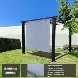 May include: A black metal pergola with a light gray shade cloth. The shade cloth is suspended from the pergola's frame. The text "CUSTOM SIZE AVAILABLE" is visible. The pergola is set on a green lawn under a blue sky.
