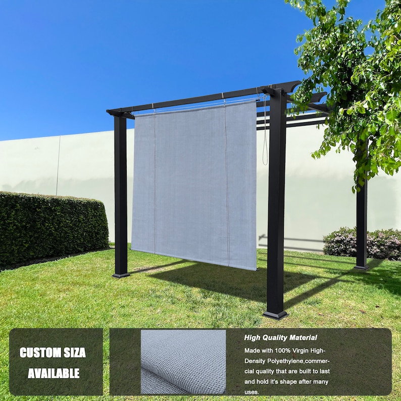 May include: A black metal pergola with a light gray shade cloth. The shade cloth is suspended from the pergola's frame. The text "CUSTOM SIZE AVAILABLE" is visible. The pergola is set on a green lawn under a blue sky.