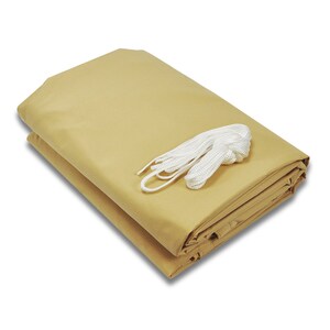 May include: A folded beige canvas canopy with a white rope attached.