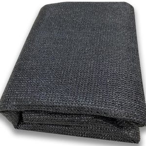 May include: Black shade cloth, a woven fabric used for providing shade and privacy. It is folded and ready to be used.