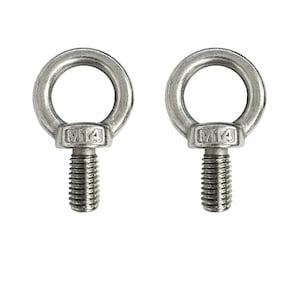 May include: Two silver metal eye bolts with a threaded shaft and a ring at the top. The ring is marked with "M14".