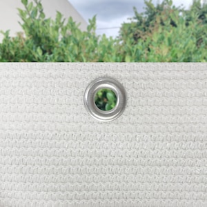 May include: White mesh fabric with a silver grommet in the center.