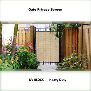 May include: A beige privacy screen for a gate, made of woven material. The screen is attached to a black metal gate frame. The text "Gate Privacy Screen", "UV Block", and "Heavy Duty" is visible on the image.