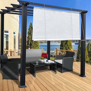 May include: A black pergola with a white retractable shade, set on a wooden deck overlooking a lake. The outdoor furniture includes a sofa, two armchairs, and a glass-top coffee table. Red flowers and white vases add color.