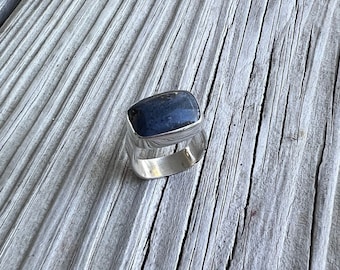 Rough cut Leland blue ring with flat D-shaped band.