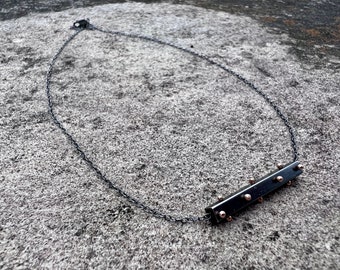 Oxidized Sterling Silver and 14k gold Spine bar necklace