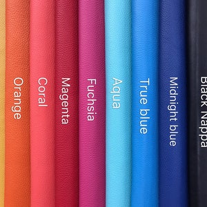 May include: A selection of leather swatches in various colors, including yellow, orange, coral, magenta, fuchsia, aqua, true blue, midnight blue, and black nappa.