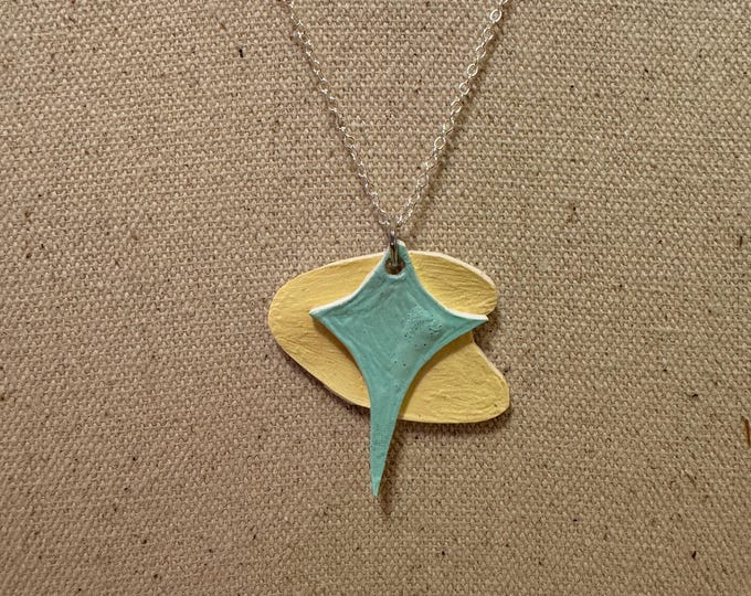 Atomic boomerang necklace