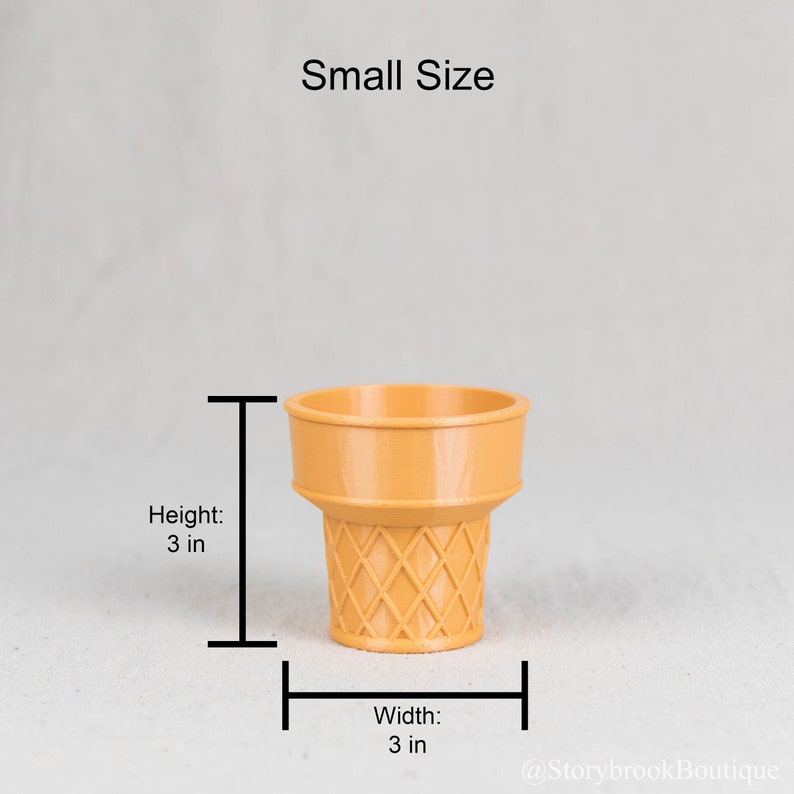 A single small sized ice cream cone planter on a plain, off white studio background. There are brackets marking the dimensions. Height: 3 inches. Width: 3 inches. The ice cream cone has a semi smooth, slightly glossy finish.