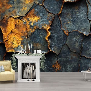 May include: A decorative wall mural with a textured, cracked appearance in shades of dark blue, gold, and rust. A white fireplace with candles and a deer figurine is in front of the mural. A yellow armchair and a small white table are also in the room.