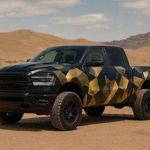 May include: A black pickup truck with a geometric gold pattern on the sides and rear. The truck has black wheels and is parked on a sandy surface. The background features desert terrain and a blue sky.