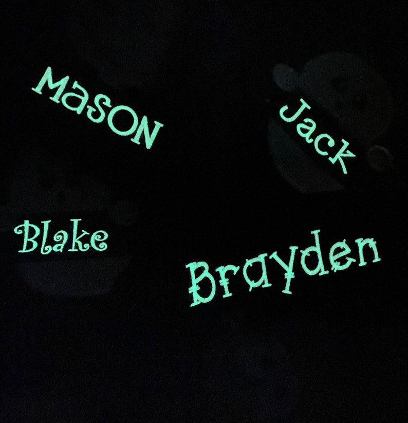 May include: A black background with four names written in a light green color: Mason, Jack, Blake, and Brayden.