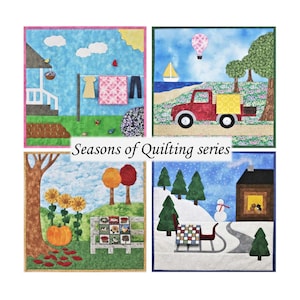 May include: Four quilted squares depicting the four seasons. The top left square shows a house with a clothesline, the top right square shows a red truck with a hot air balloon in the sky, the bottom left square shows a pumpkin and sunflowers, and the bottom right square shows a snowman and a sled.
