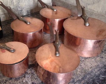Five Dehillerin thick copper saucepans with stick lids, vintage, tin lined